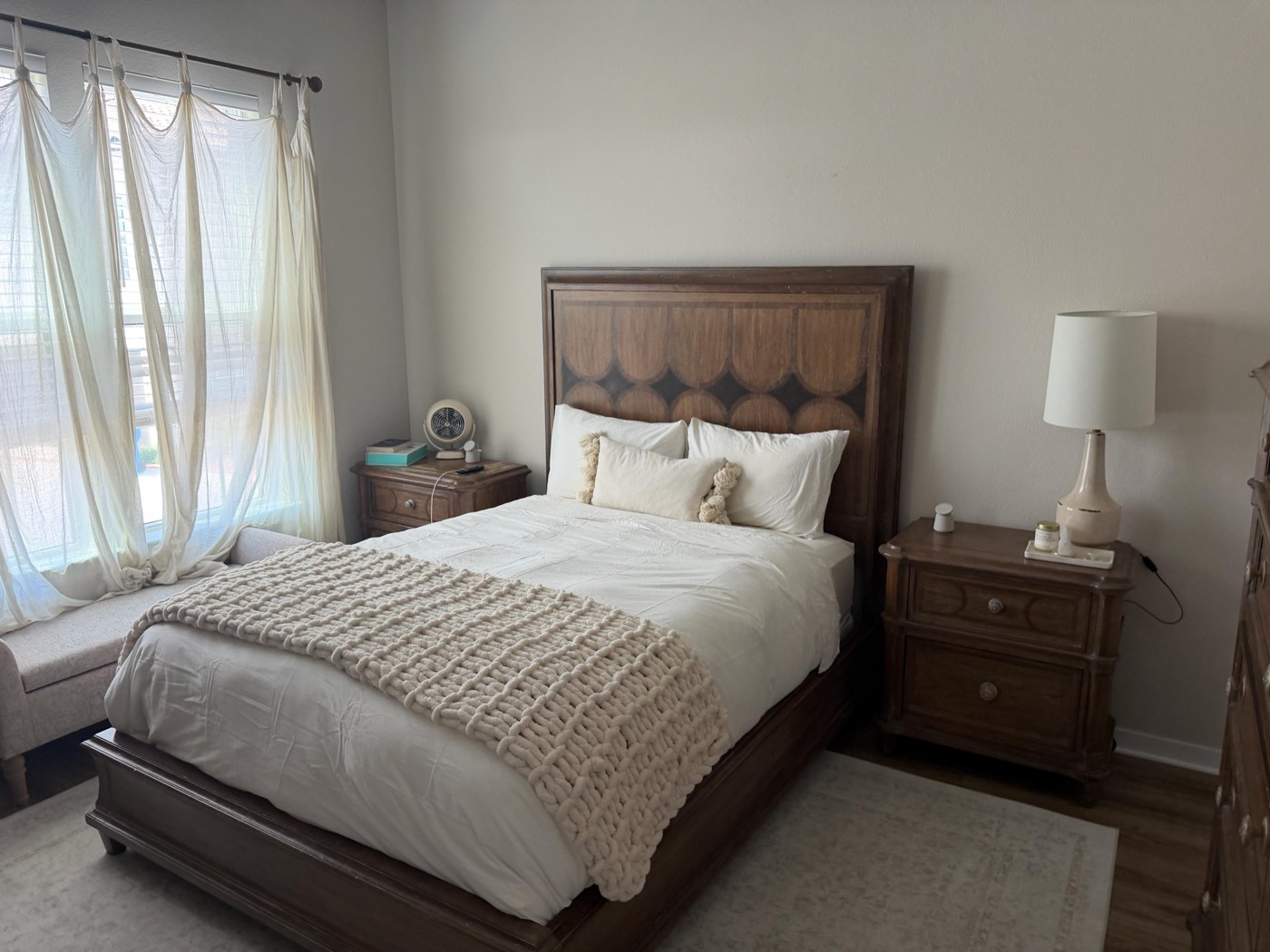 Bedroom with fresh linens after a Sage Essence cedar season cleaning visit in Austin