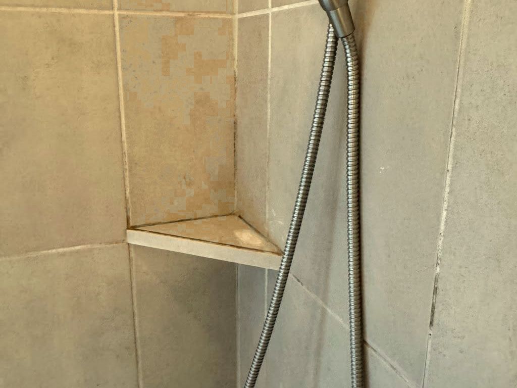 Shower before Sage Essence non-toxic cleaning in Austin, TX